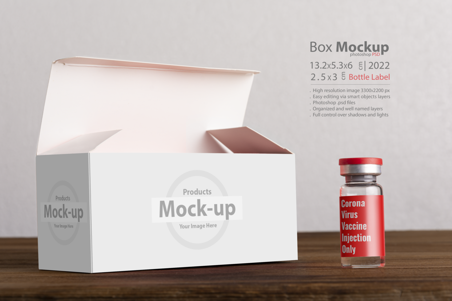 Opened vials box with a vial at front on wooden board psd