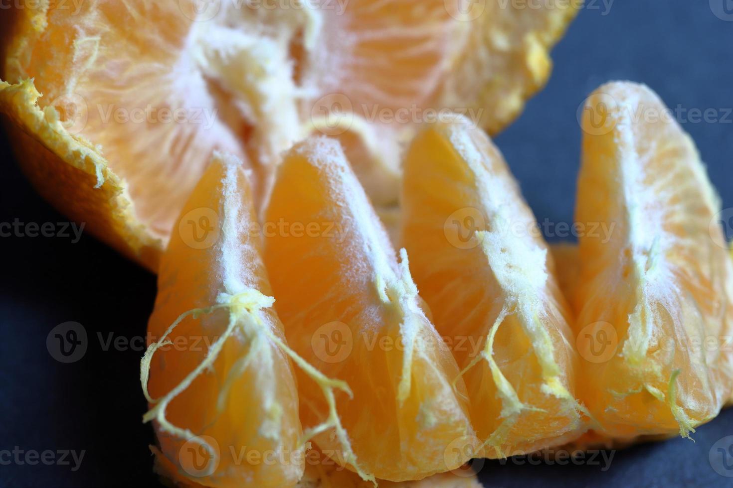 Orange peeled skin on a texture background photo