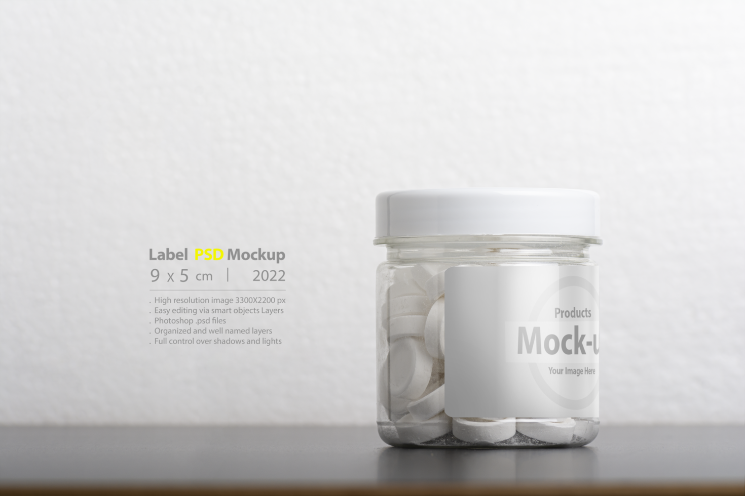 Round mint pills inside plastic bottle in front of white background psd