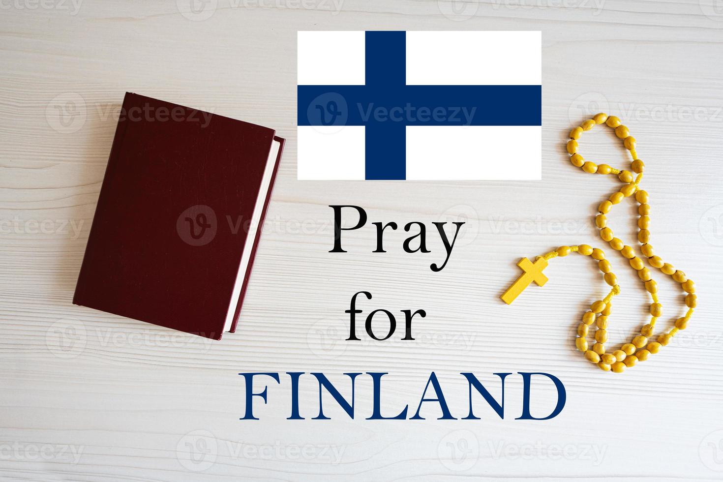 Pray for Finland. Rosary and Holy Bible background. photo