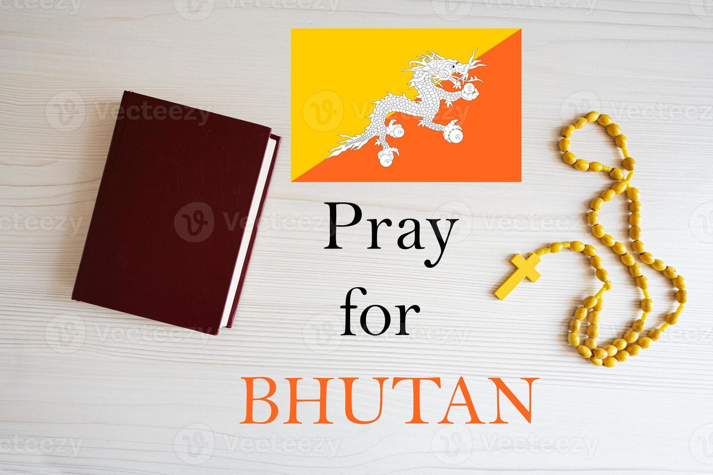 Pray for Bhutan. Rosary and Holy Bible background. photo