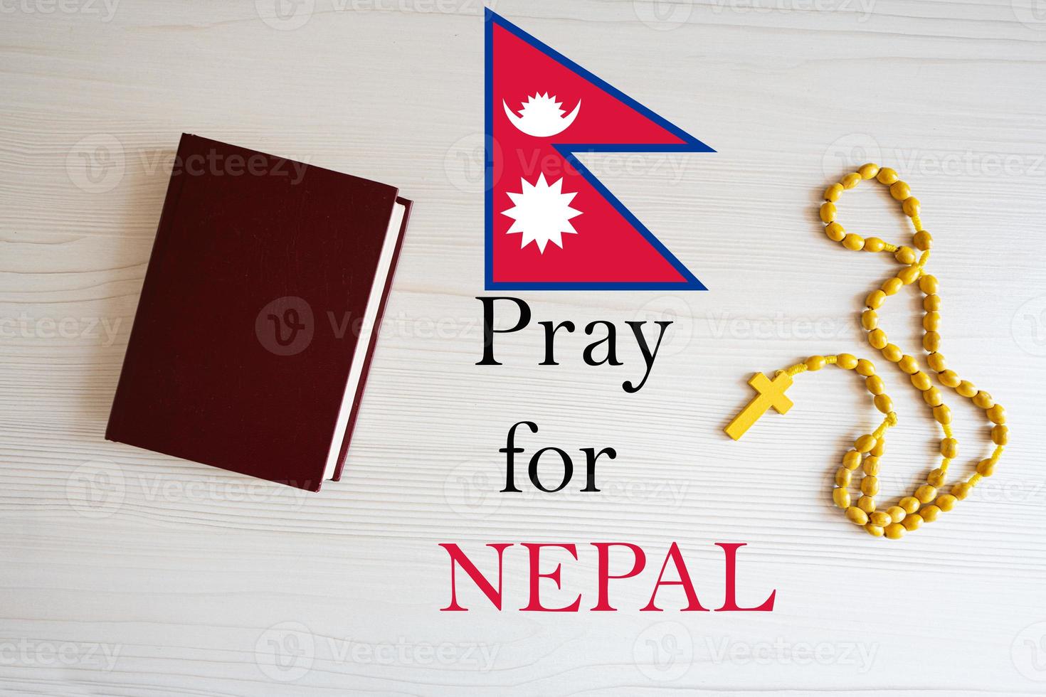 Pray for Nepal. Rosary and Holy Bible background. photo