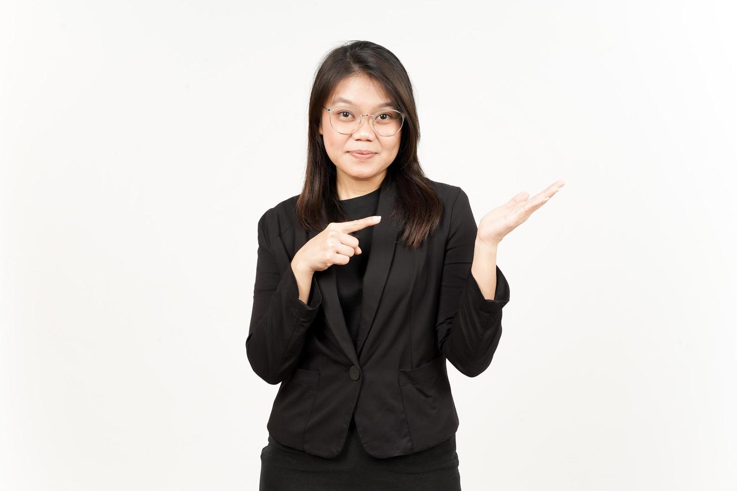 Showing and Presenting Product on Open Palm Of Beautiful Asian Woman Wearing Black Blazer photo