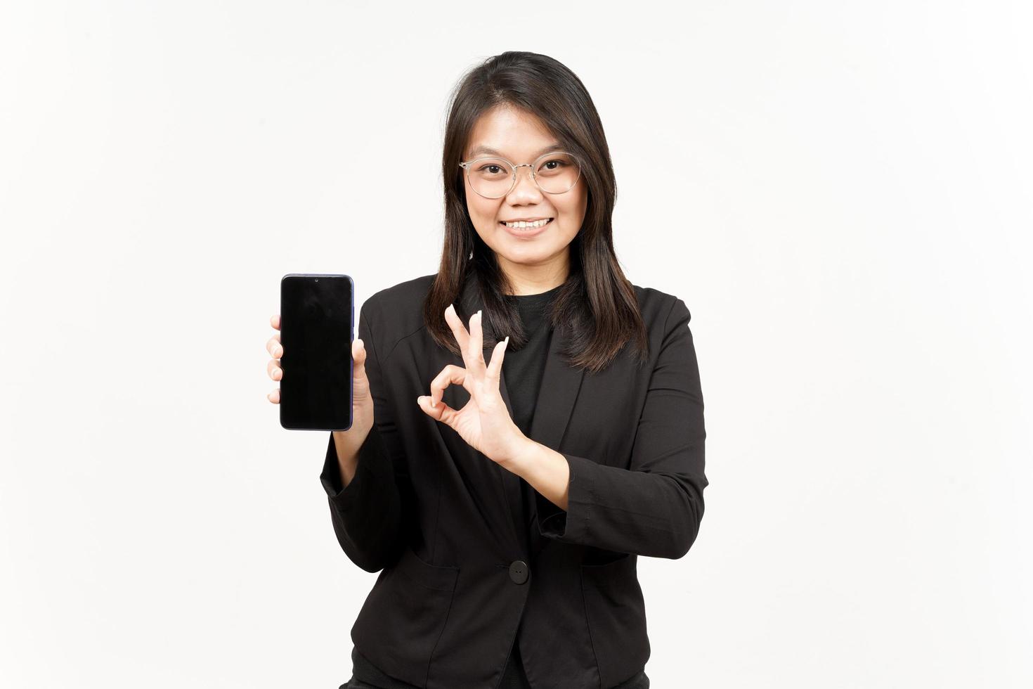 Showing Apps or Ads On Blank Screen Smartphone Of Beautiful Asian Woman Wearing Black Blazer photo