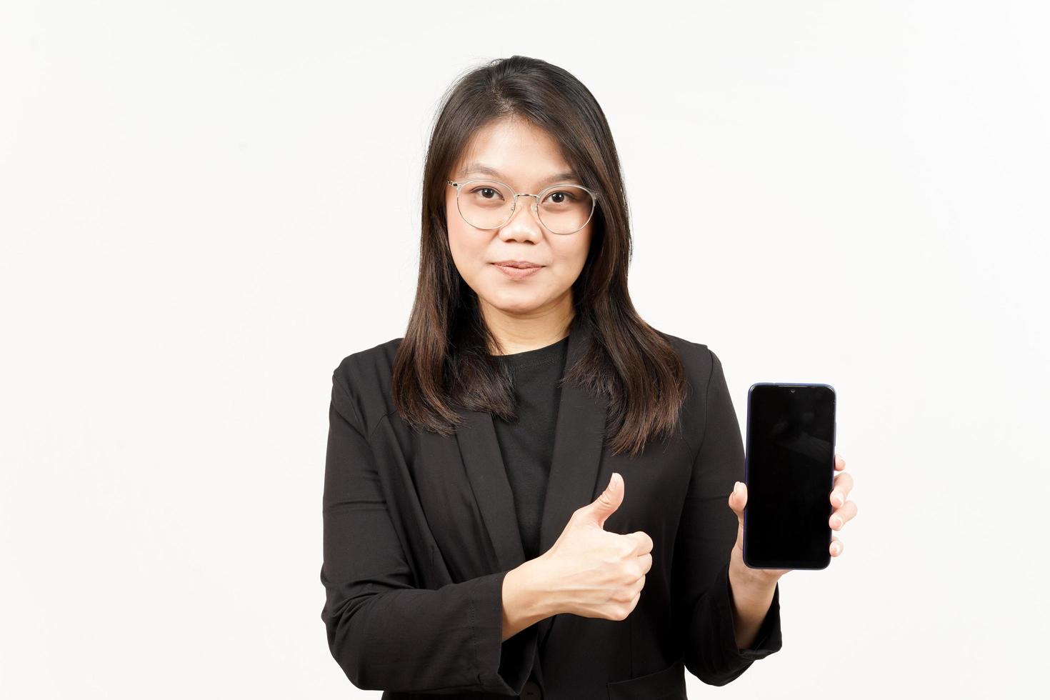 Showing Apps or Ads On Blank Screen Smartphone Of Beautiful Asian Woman Wearing Black Blazer photo