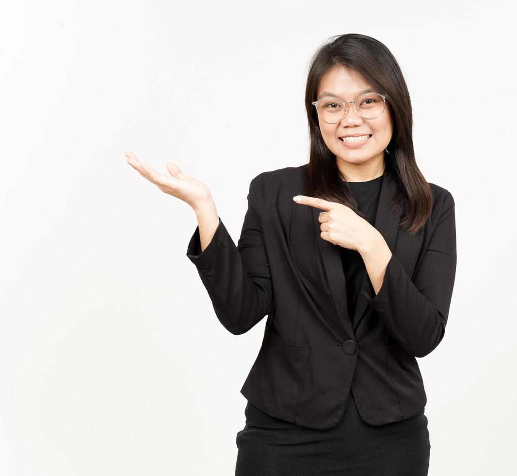 Showing and Presenting Product on Open Palm Of Beautiful Asian Woman Wearing Black Blazer photo