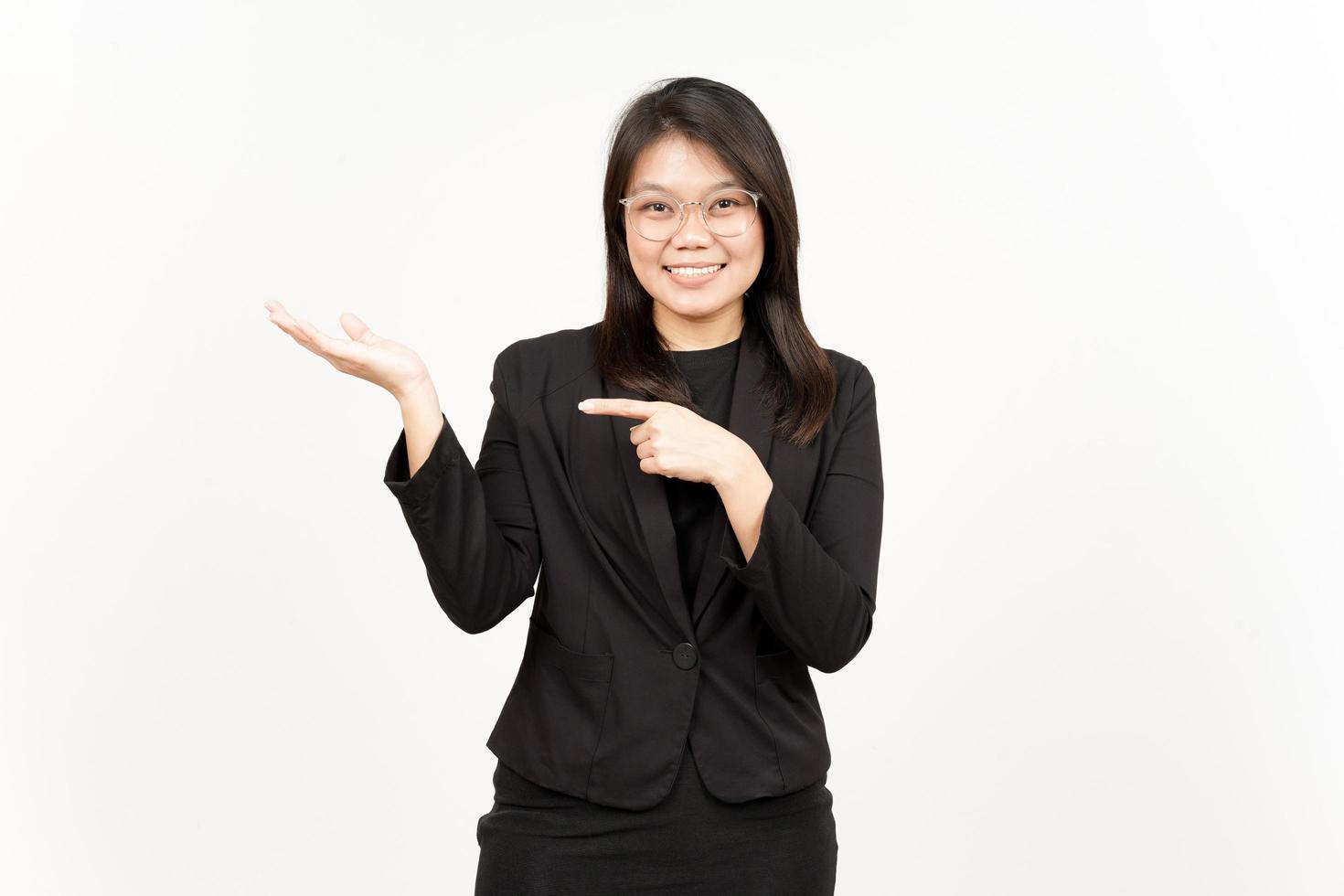 Showing and Presenting Product on Open Palm Of Beautiful Asian Woman Wearing Black Blazer photo
