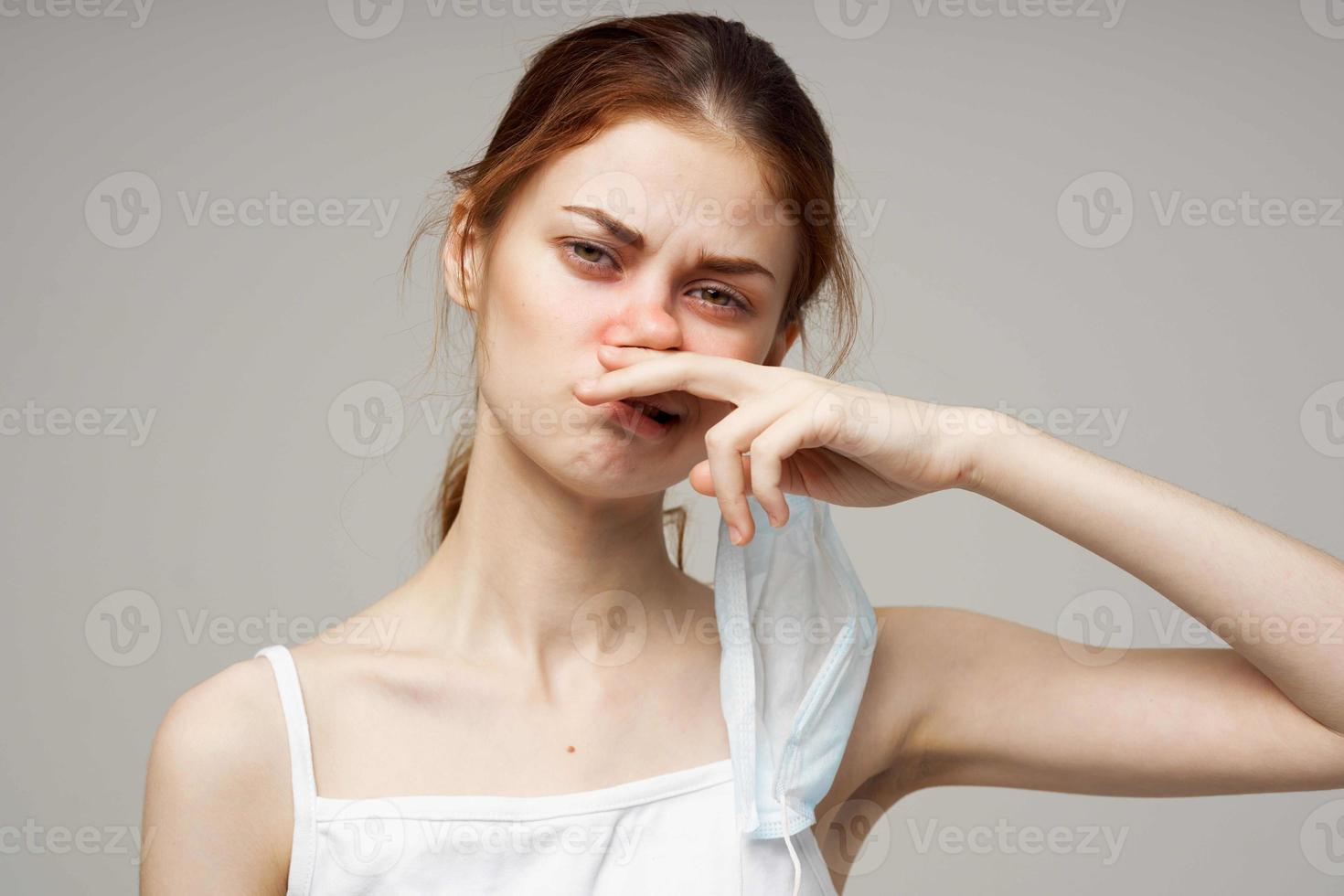 red-haired woman in white t-shirt with a scarf light background photo