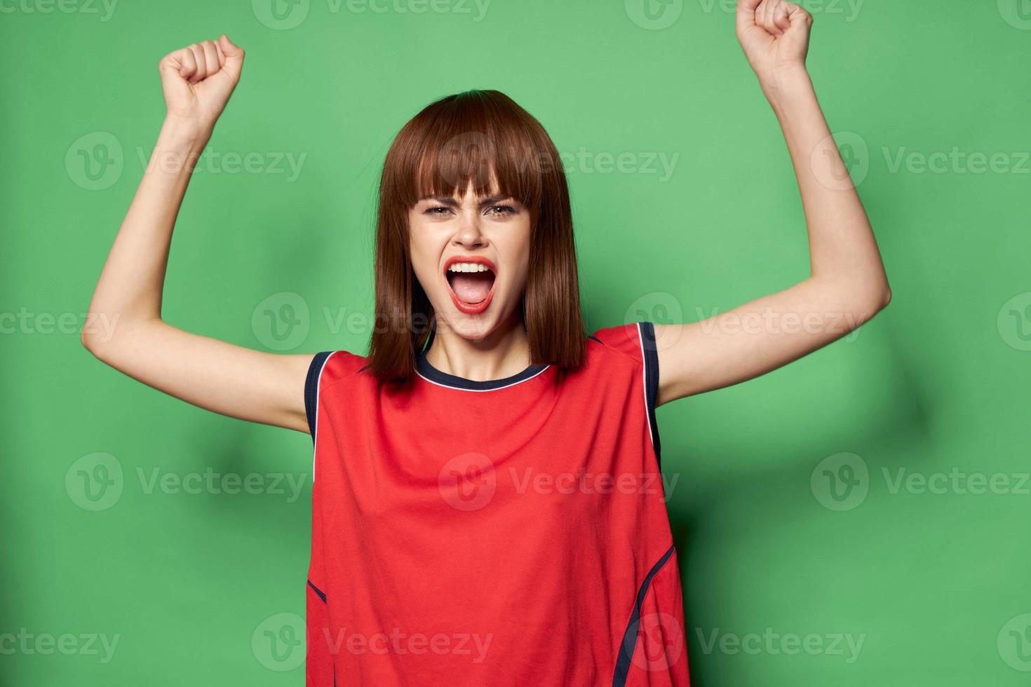 female fan is rooting for a team in a football game photo