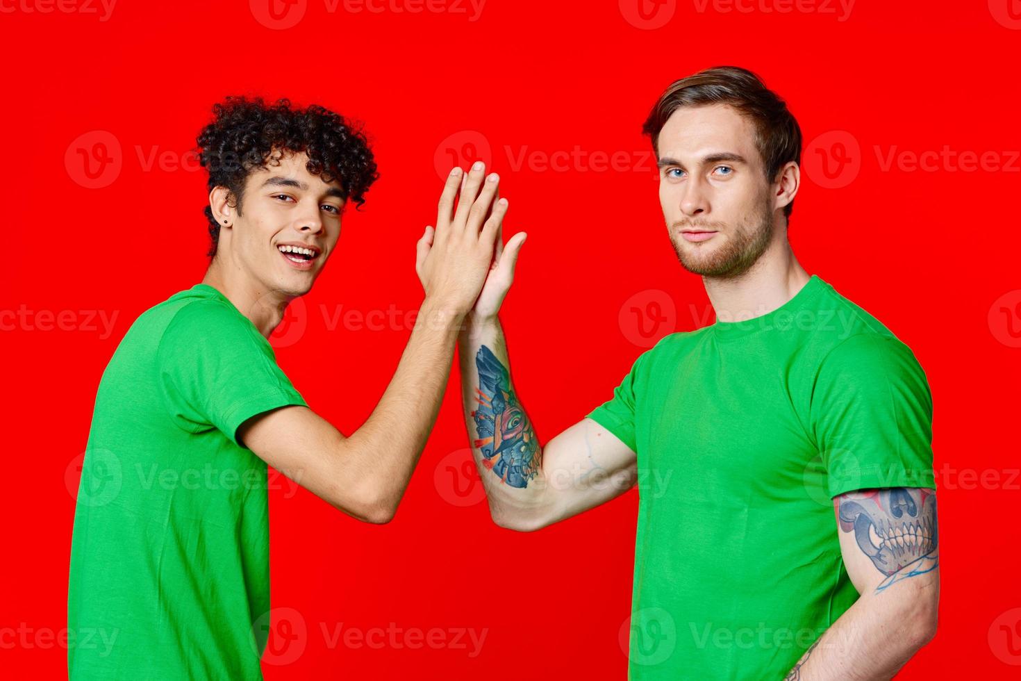 Two cheerful friends holding hands fun emotions photo