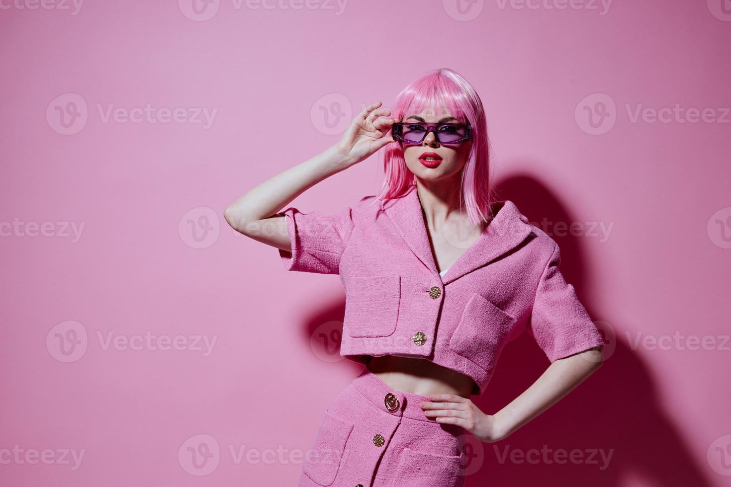 Pretty young female gestures with his hands with a pink jacket Studio Model unaltered photo