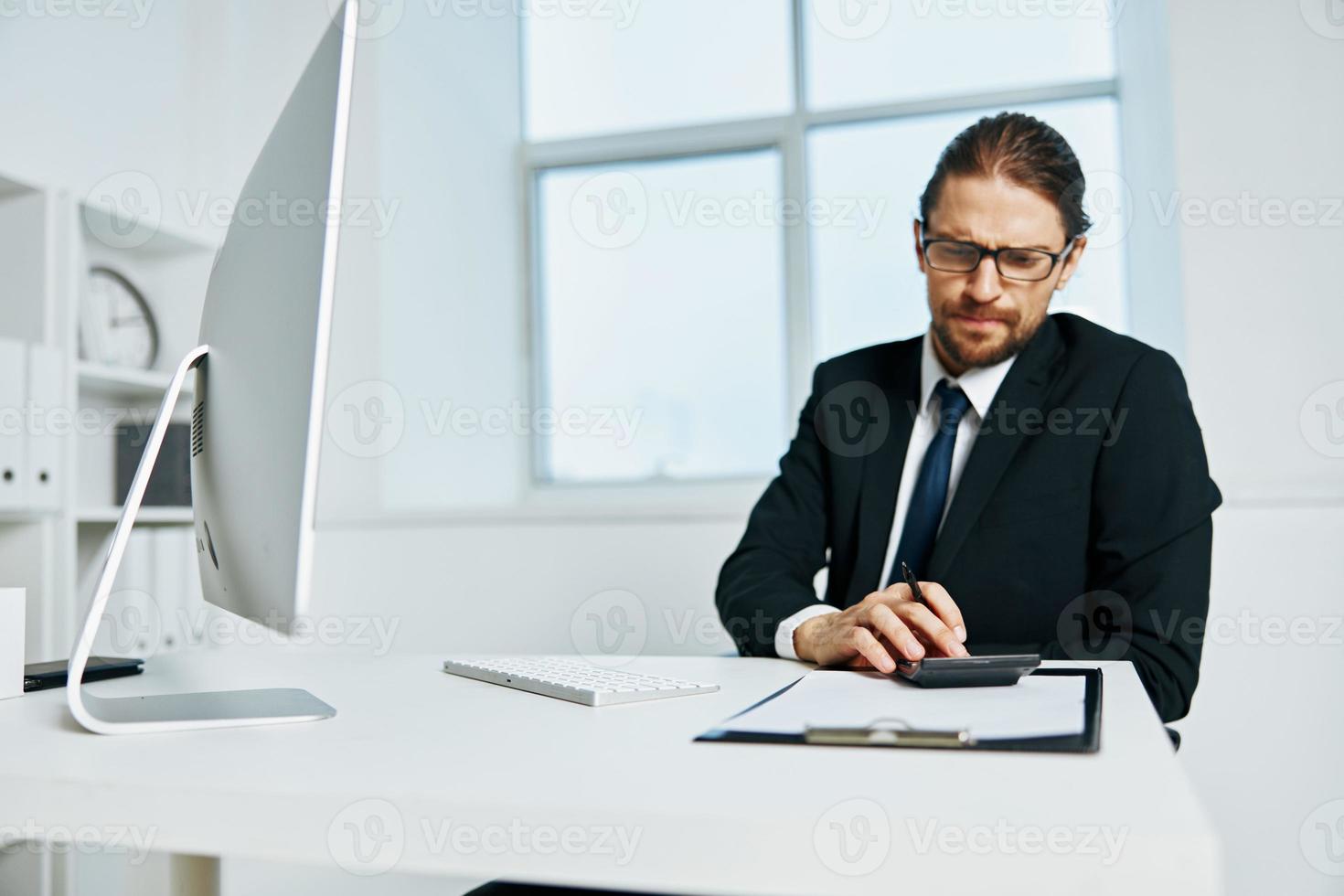man in a suit documents in hand communication by phone Lifestyle photo