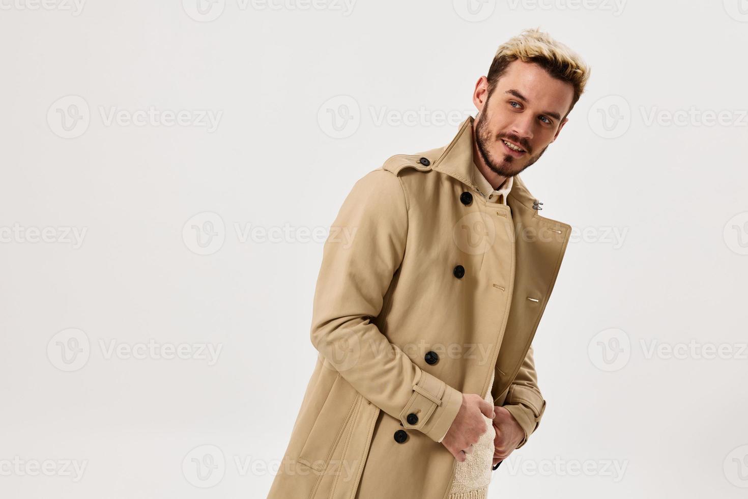 handsome man beige coat studio attractive look modern style isolated background photo