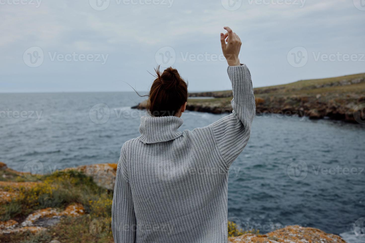 portrait of a woman beach tourism cloudy weather stone coast female relaxing photo
