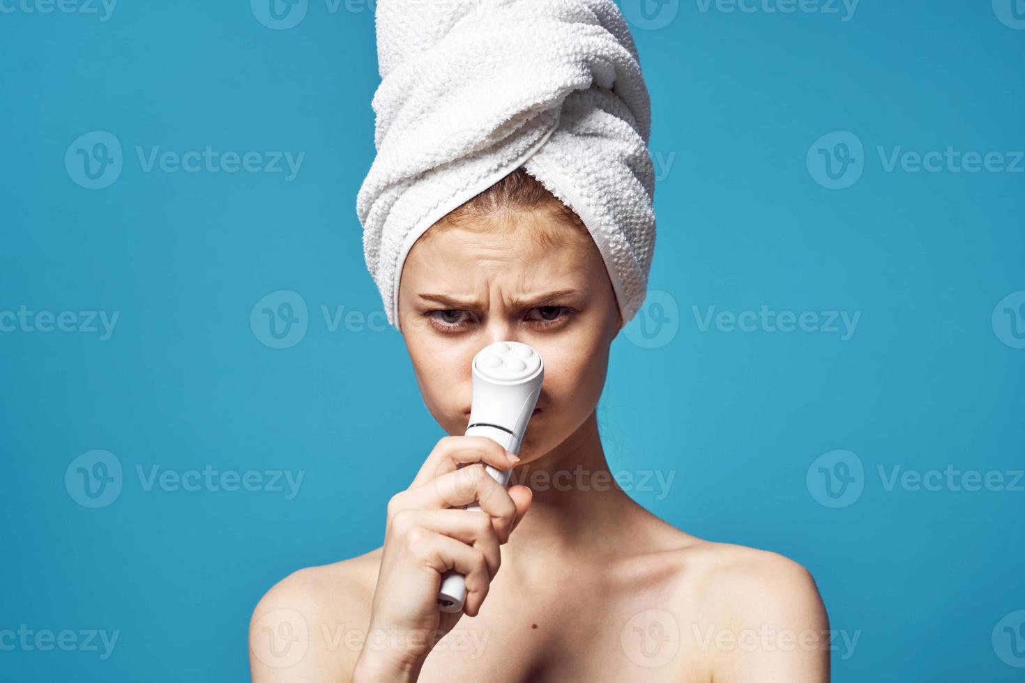 woman with bare shoulders towel on head clean skin cosmetology photo