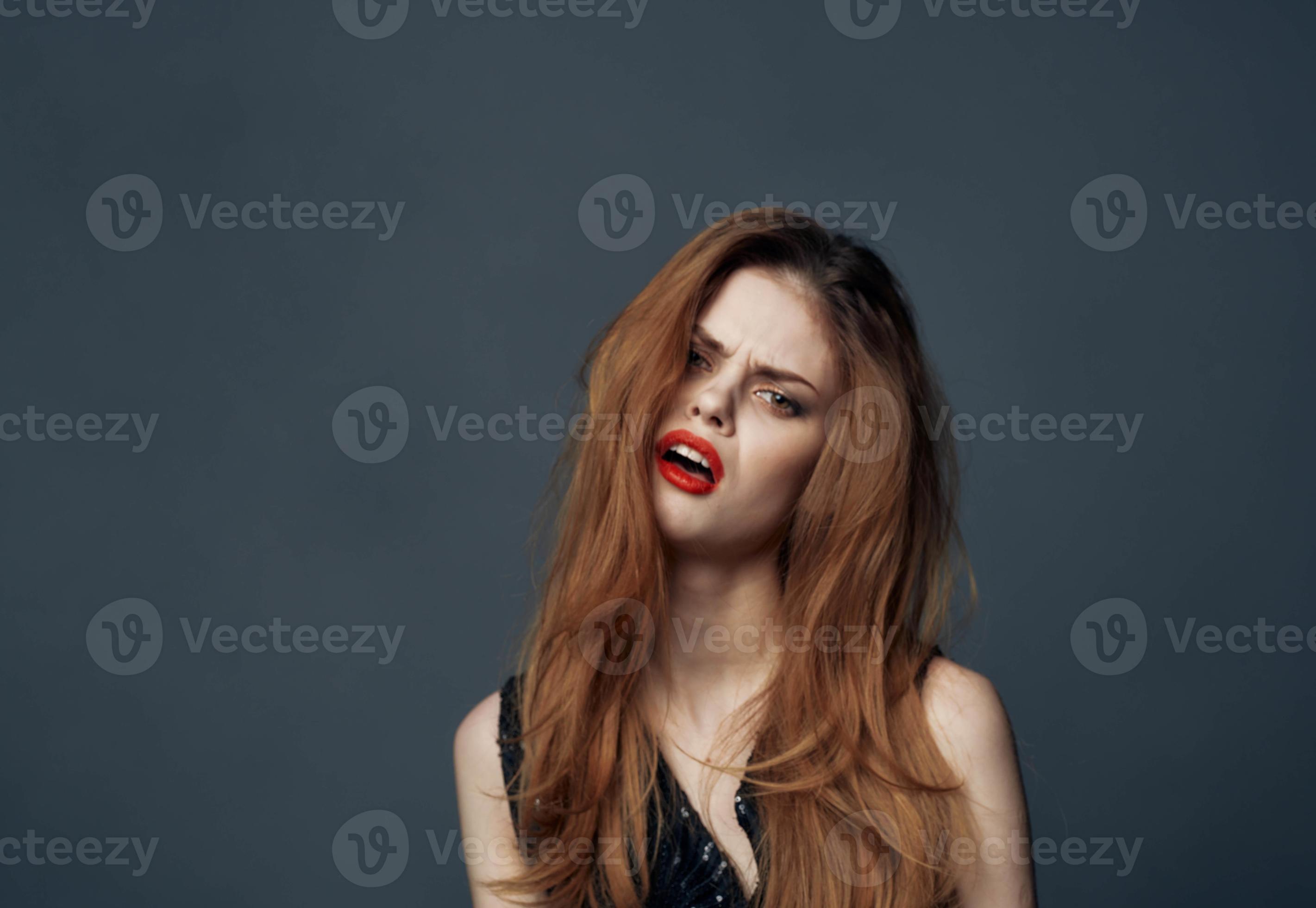 impulsive woman on a gray background indignant Look model and black dress 22450182 Stock Photo