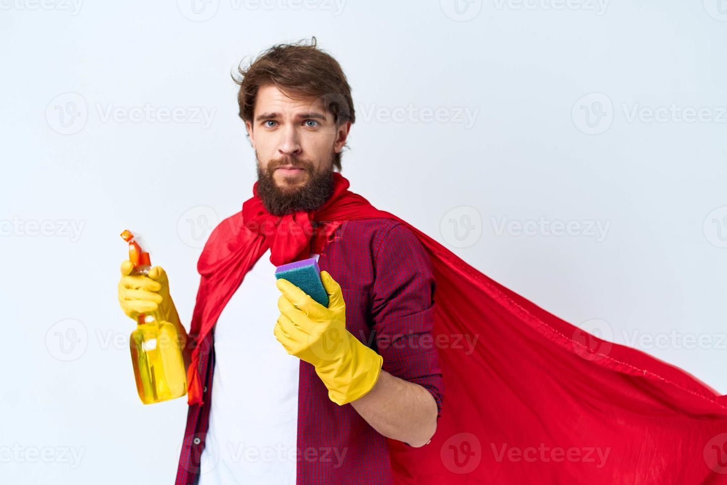 Man in red raincoat cleaning supplies housework service Professional photo