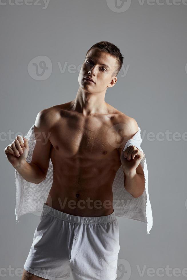 handsome sporty man bodybuilder white towel lifestyle fitness photo
