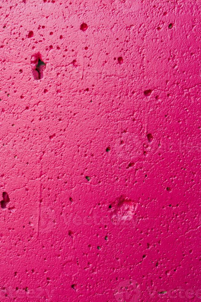 Bright pink plaster wall background photo