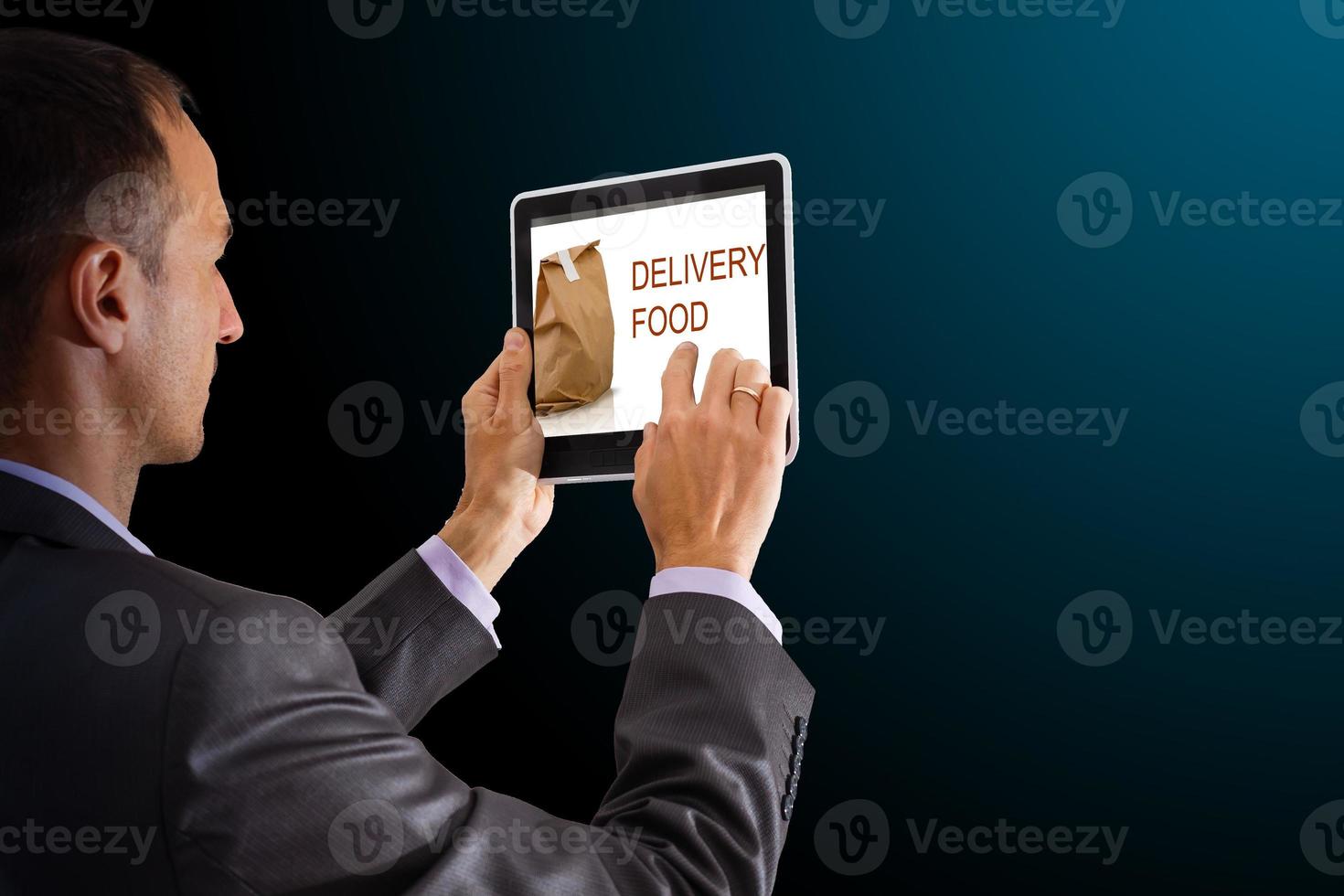 On-line and Internet food delivery concept with a digital tablet photo