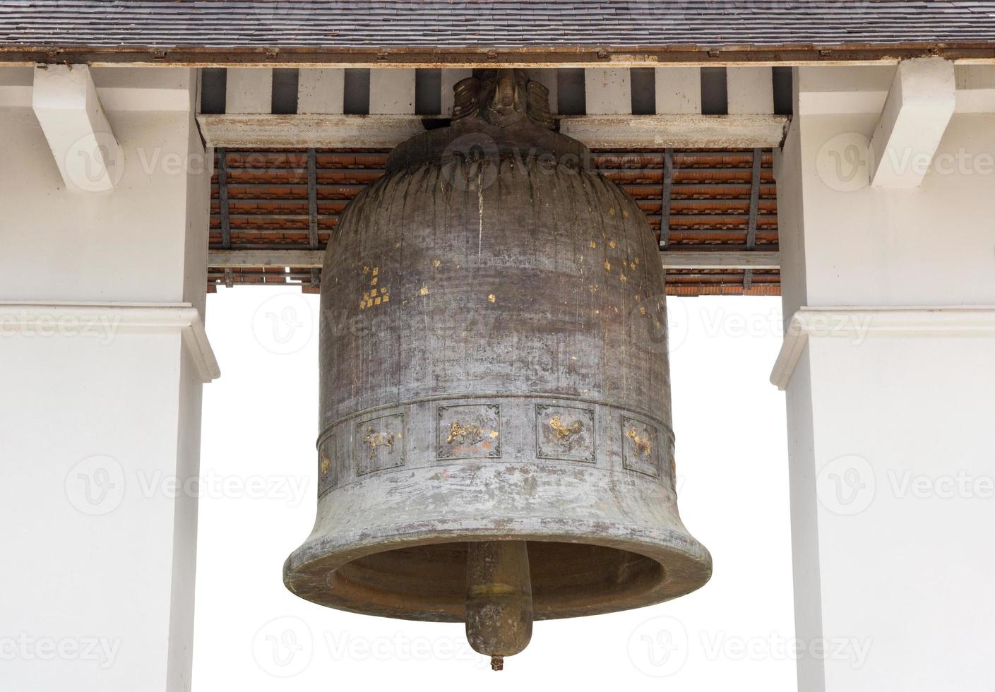 Old church bell isolated on white in the temple of lamphun, thailand photo
