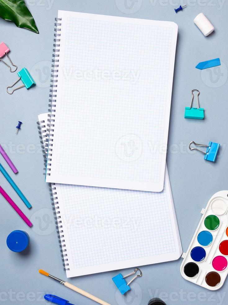 table with open notebook with ballpoint pen, stationery. Business concept planning a day, writing a to-do list, checklist. Top view of workspace photo