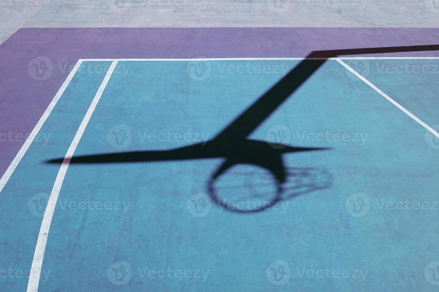 basketball-hoop-shadow-on-the-basketball-court-22452528-stock-photo-at
