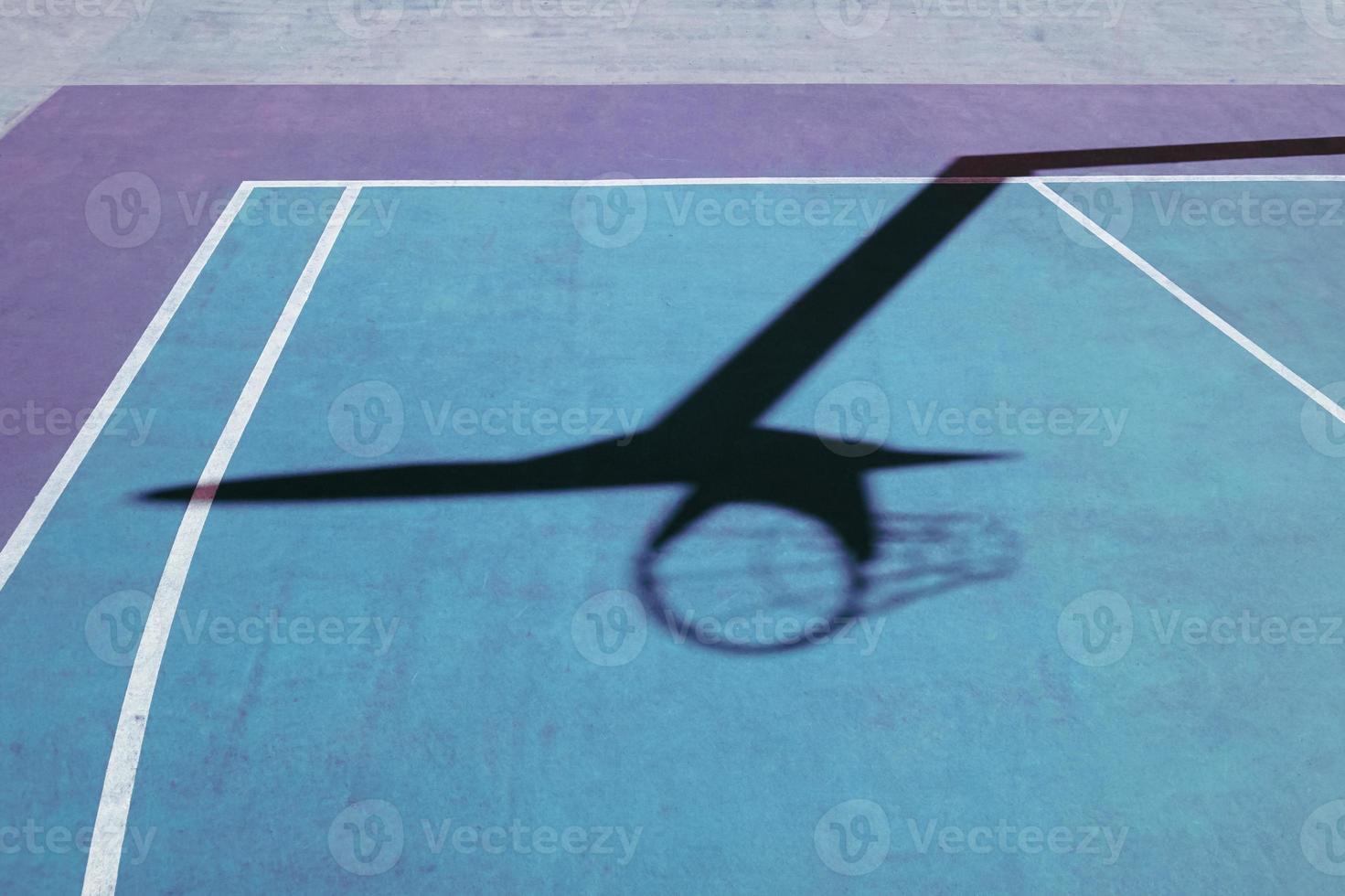 basketball hoop shadow on the basketball court photo