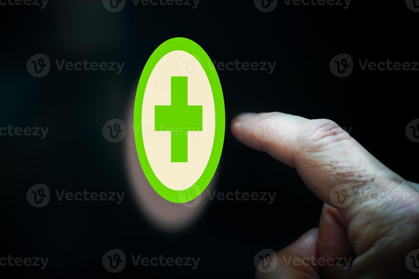 index finger pointing at health app, health insurance photo