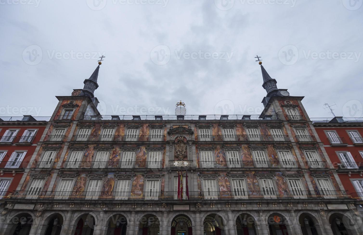 Plaza Mayor is a city square and skyline built during the reign of Felipe III in Madrid, Spain, with its colorful buildings and distinctive architecture. photo