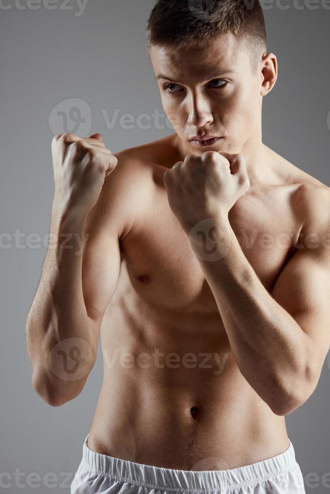boxer pumped up muscle fist gray background workout photo