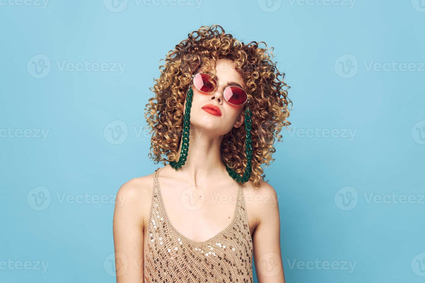 Portrait of a woman Sunglasses ornaments red lips curly hair photo