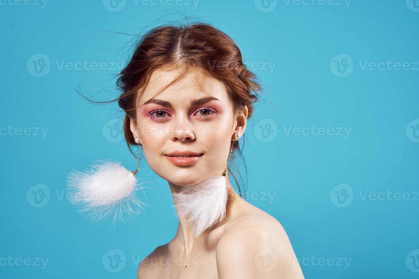 pretty woman bright makeup decoration nude shoulders fashion blue background photo