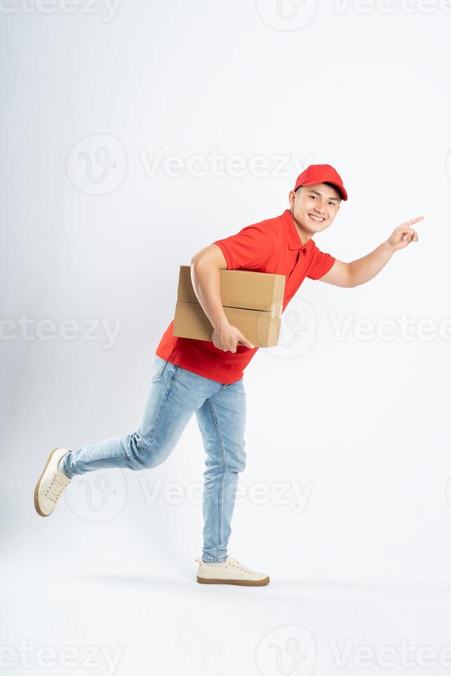 portrait of asian delivery man on white background photo