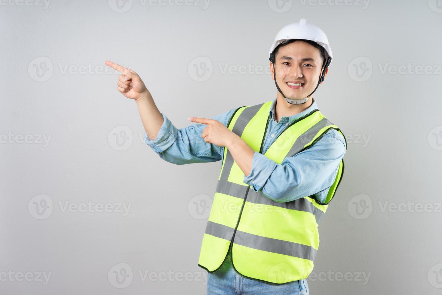 Asian engineer portrait on gray background photo