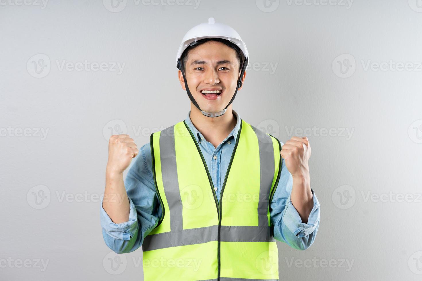Asian engineer portrait on gray background photo