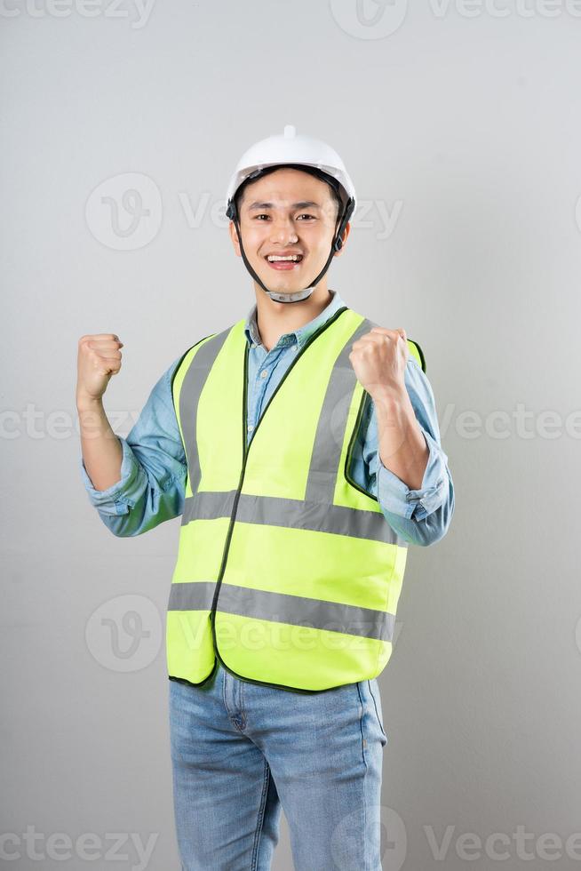 Asian engineer portrait on gray background photo