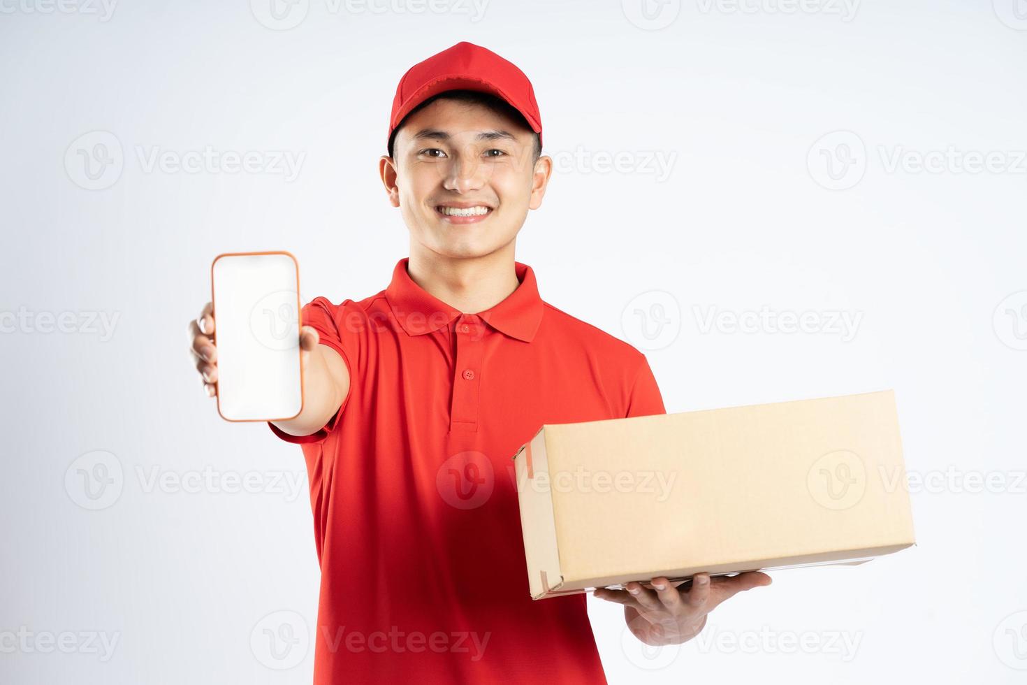 portrait of asian delivery man on white background photo