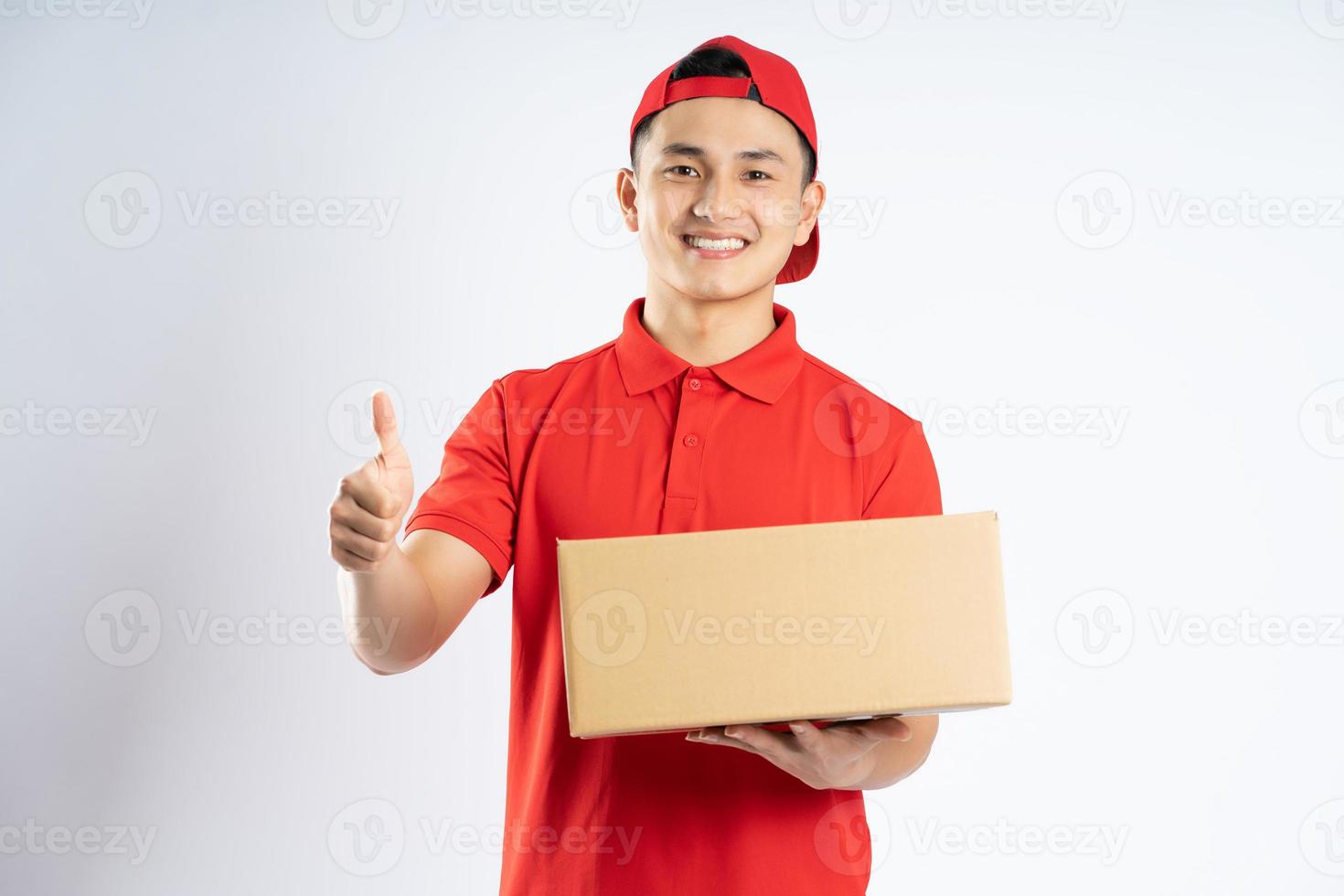 portrait of asian delivery man on white background photo