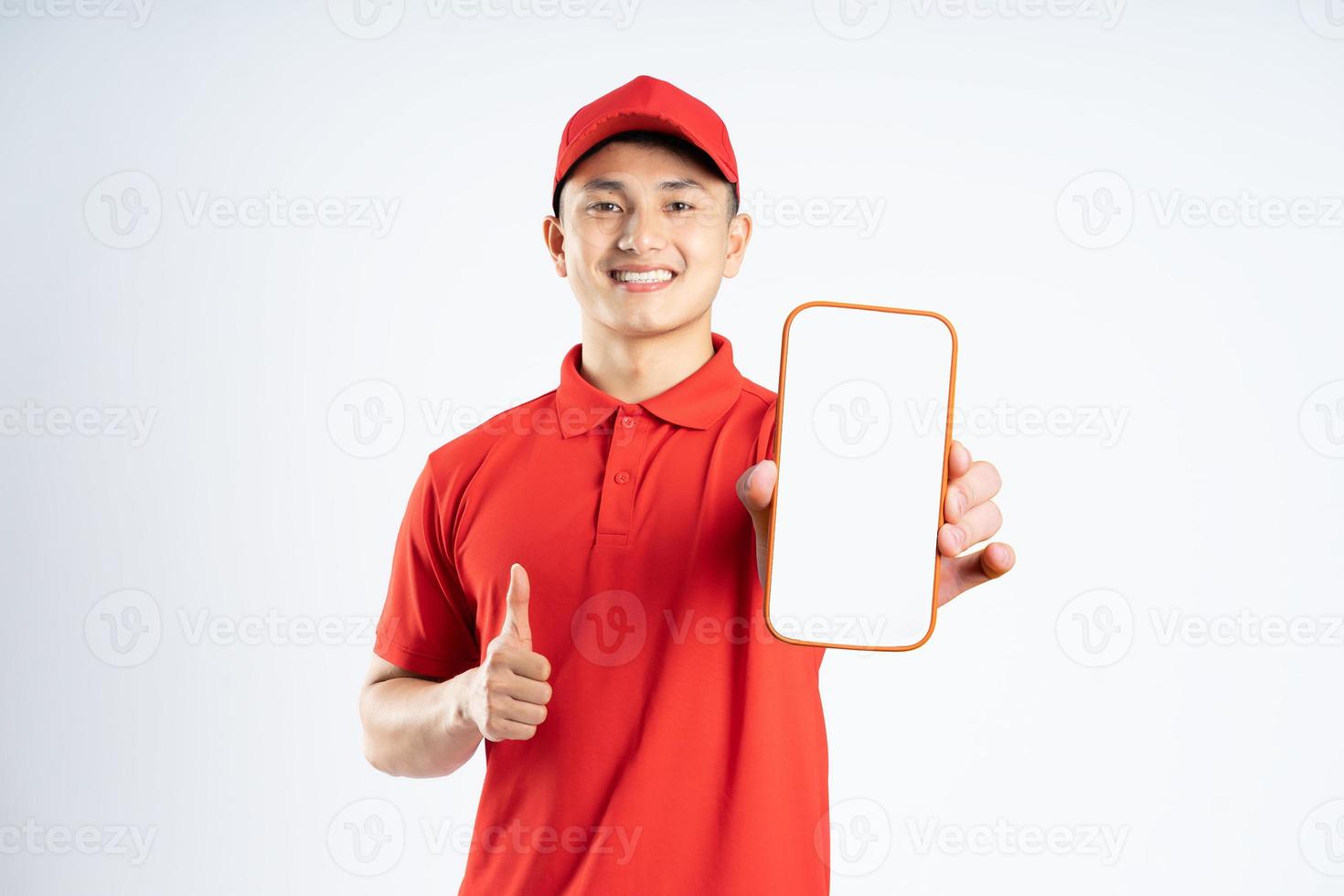 portrait of asian delivery man on white background photo
