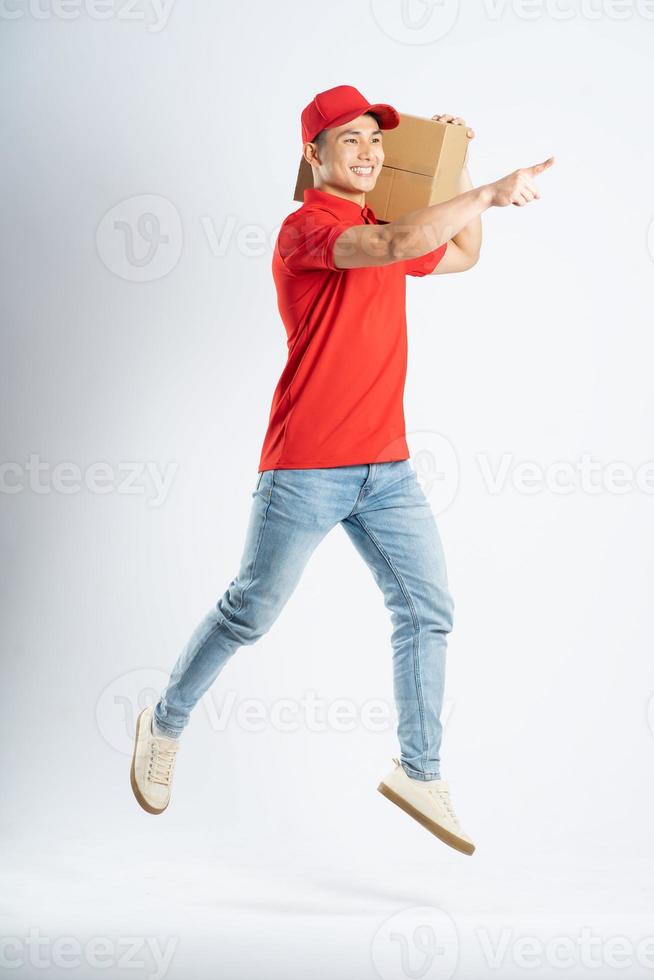 portrait of asian delivery man on white background photo