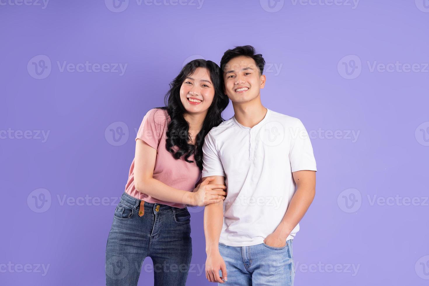image of asian couple posing on purple background photo