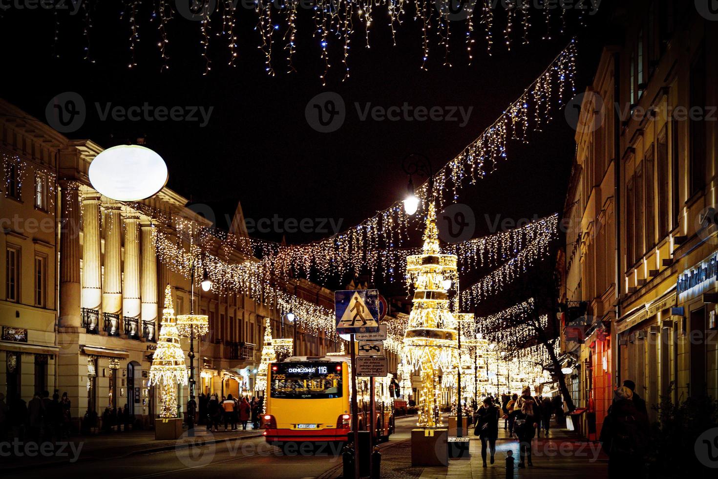 streets at night with decorations for Christmas Warsaw Poland in the city center photo