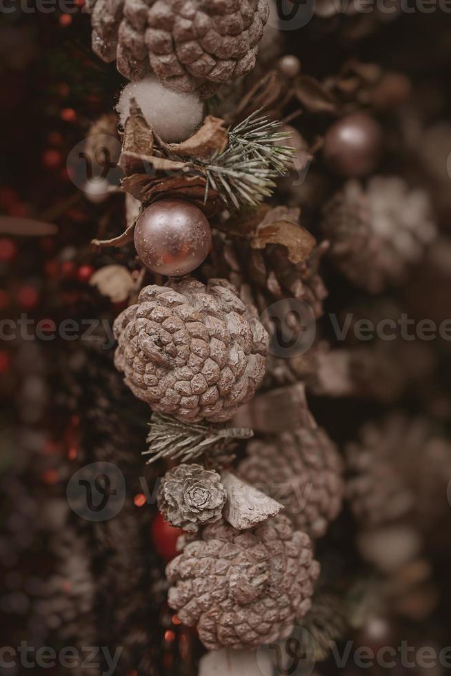 christmas decorations brown cones in a beige background in close-up photo