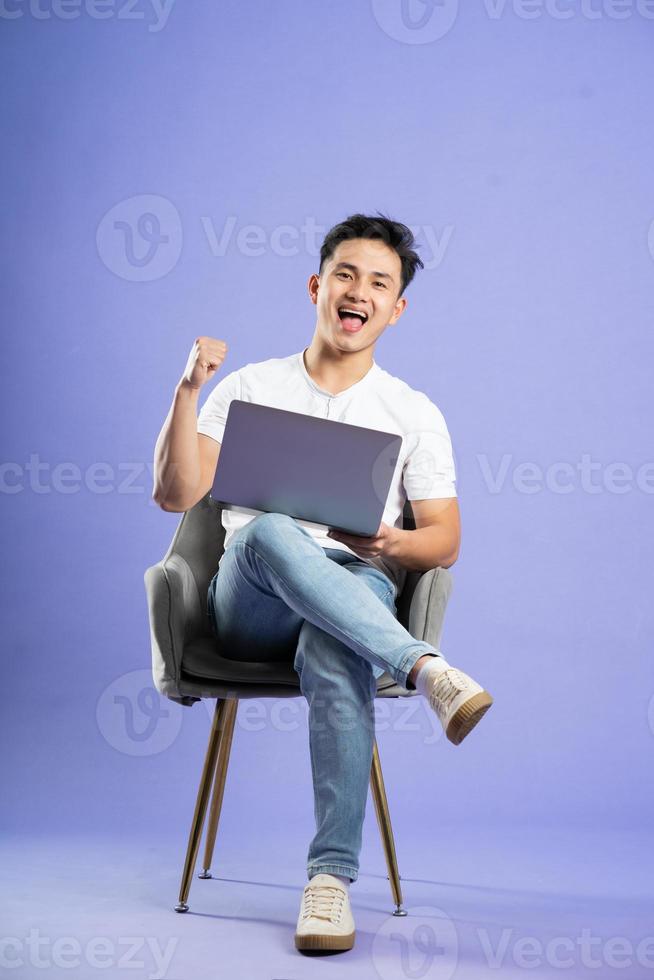image of asian boy posing on purple background photo