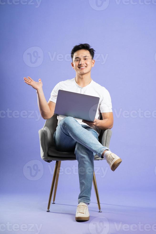 image of asian boy posing on purple background photo