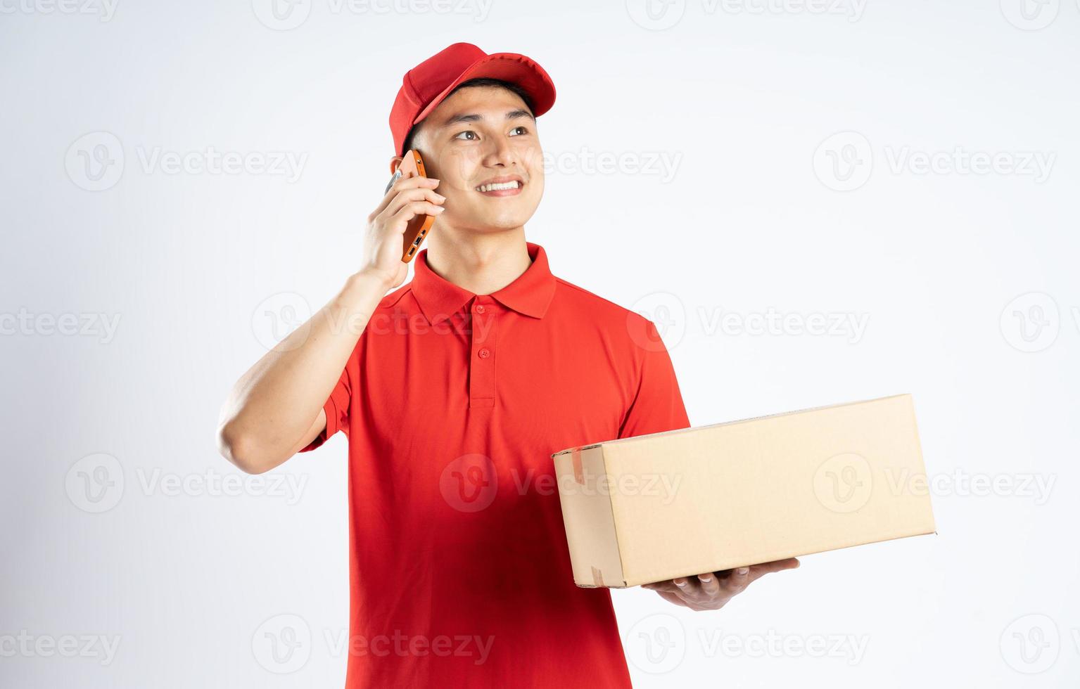 portrait of asian delivery man on white background photo