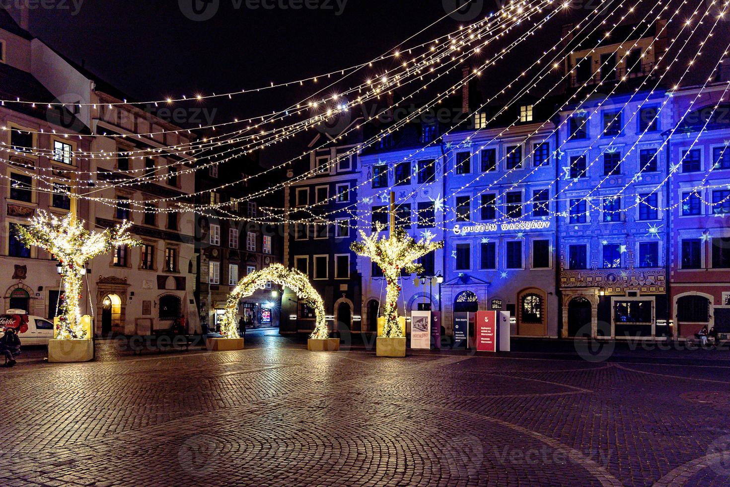 streets at night with decorations for Christmas Warsaw Poland in the city center photo