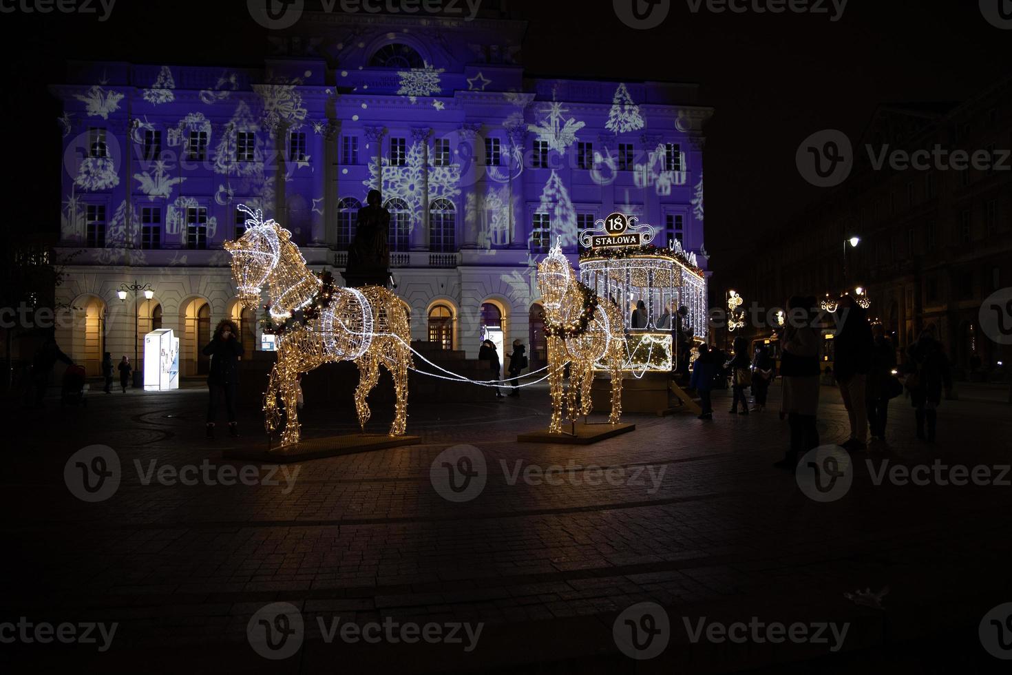 streets at night with decorations for Christmas Warsaw Poland in the city center photo