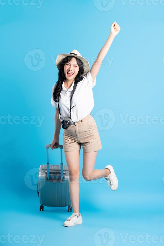 Portrait of beautiful asian girl traveling, isolated on white background photo